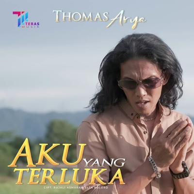 Aku Yang Terluka By Thomas Arya's cover